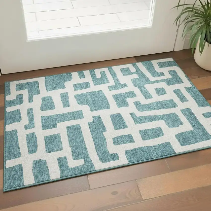Teal And Ivory Abstract Geometric Washable Area Rug With UV Protection Photo 1