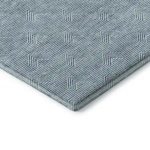 Photo of Teal And Ivory Abstract Geometric Washable Area Rug With UV Protection