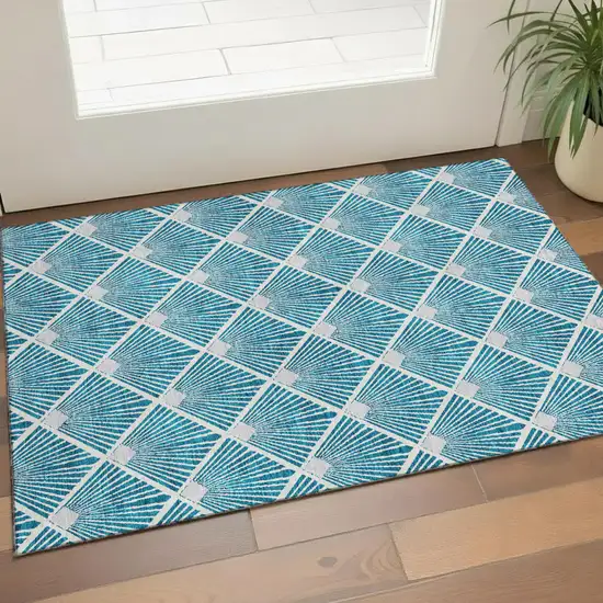 Teal And Ivory Abstract Geometric Washable Area Rug With UV Protection Photo 1