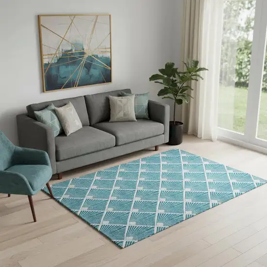 Teal And Ivory Abstract Geometric Washable Area Rug With UV Protection Photo 1