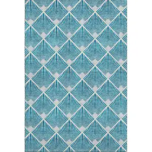 Photo of Teal And Ivory Abstract Geometric Washable Area Rug With UV Protection