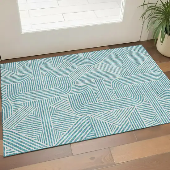 Teal And Ivory Abstract Geometric Washable Area Rug With UV Protection Photo 1
