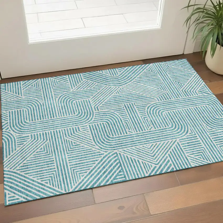Teal And Ivory Abstract Geometric Washable Area Rug With UV Protection Photo 1