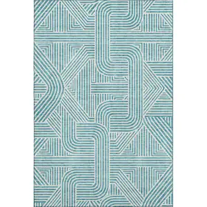 Photo of Teal And Ivory Abstract Geometric Washable Area Rug With UV Protection