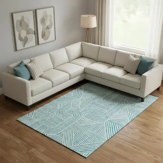 Teal And Ivory Abstract Geometric Washable Area Rug With UV Protection Photo 1