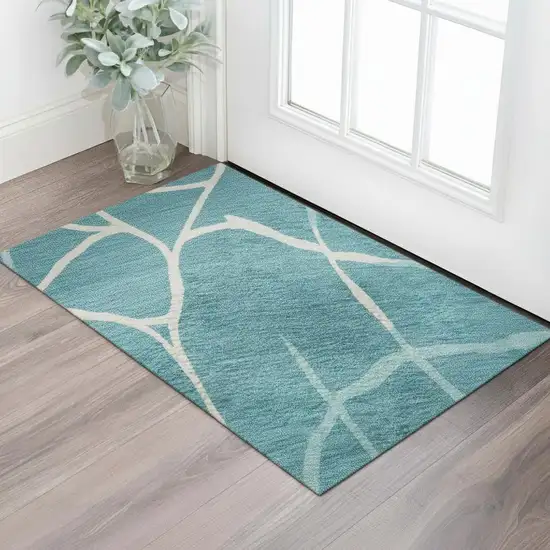 Teal And Ivory Abstract Geometric Washable Area Rug With UV Protection Photo 2