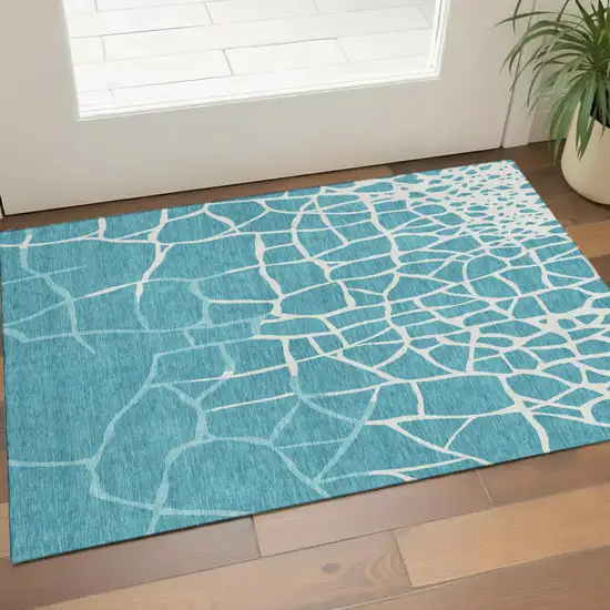 Teal And Ivory Abstract Geometric Washable Area Rug With UV Protection Photo 1