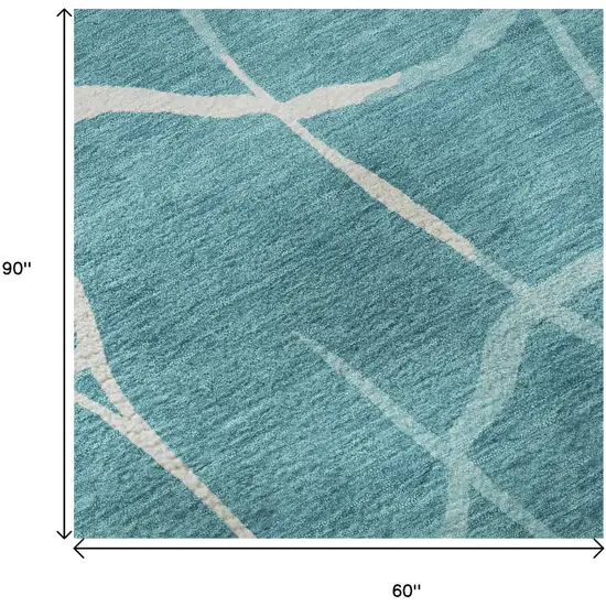 Teal And Ivory Abstract Geometric Washable Area Rug With UV Protection Photo 8