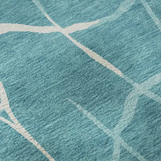 Teal And Ivory Abstract Geometric Washable Area Rug With UV Protection Photo 1