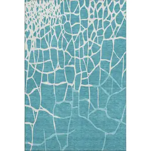Photo of Teal And Ivory Abstract Geometric Washable Area Rug With UV Protection