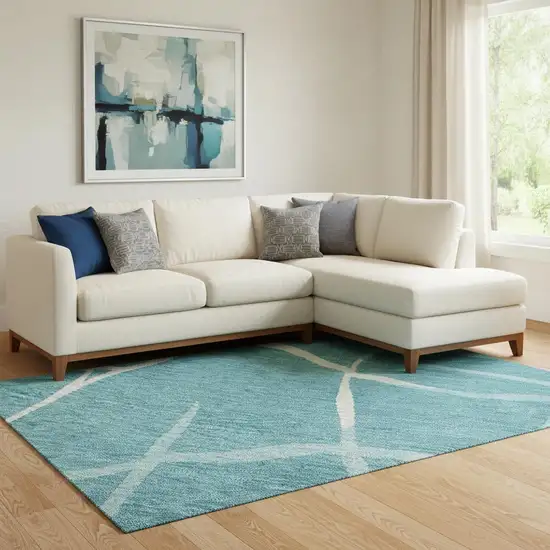 Teal And Ivory Abstract Geometric Washable Area Rug With UV Protection Photo 2