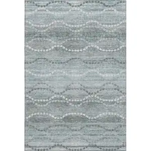 Photo of Teal And Ivory Abstract Geometric Washable Area Rug With UV Protection