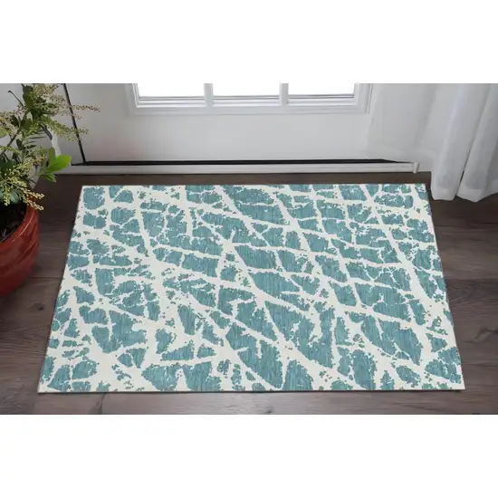 Teal And Ivory Abstract Washable Area Rug With UV Protection Photo 2