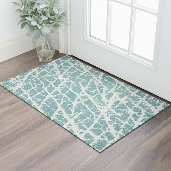 Teal And Ivory Abstract Washable Area Rug With UV Protection Photo 1