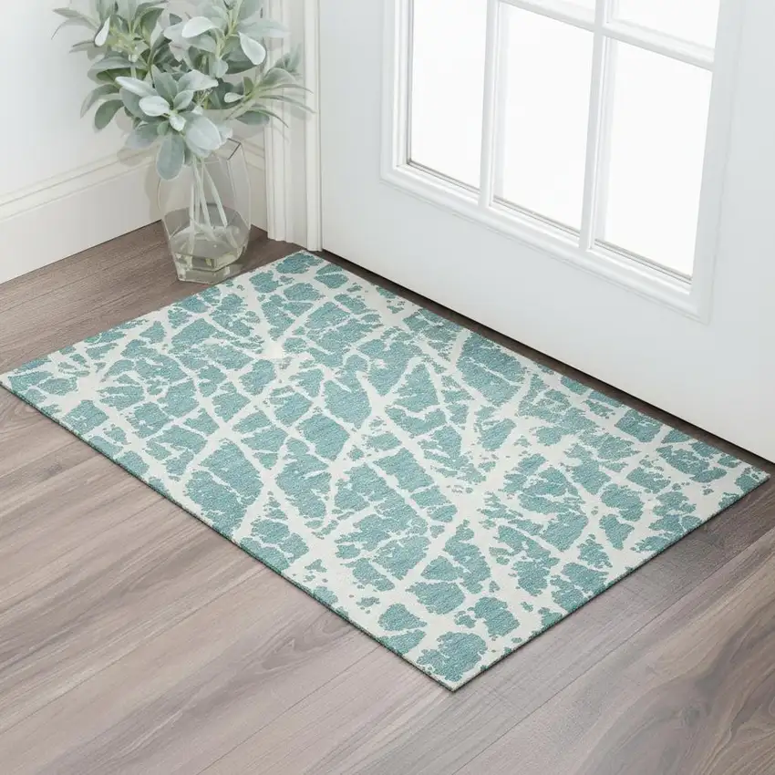 Teal And Ivory Abstract Washable Area Rug With UV Protection Photo 1