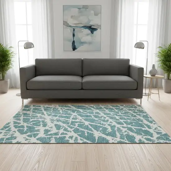 Teal And Ivory Abstract Washable Area Rug With UV Protection Photo 1