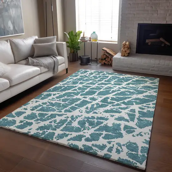 Teal And Ivory Abstract Washable Area Rug With UV Protection Photo 6
