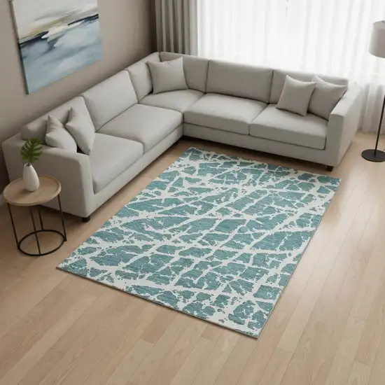 Teal And Ivory Abstract Washable Area Rug With UV Protection Photo 1