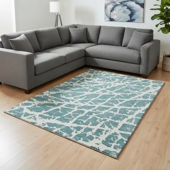 Teal And Ivory Abstract Washable Area Rug With UV Protection Photo 1