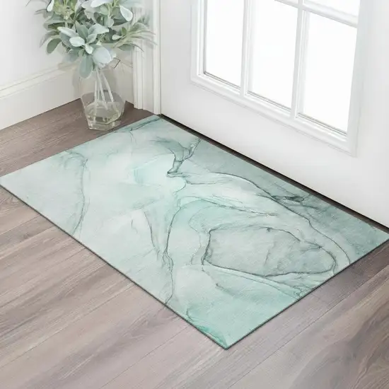 Teal And Ivory Abstract Washable Area Rug With UV Protection Photo 1