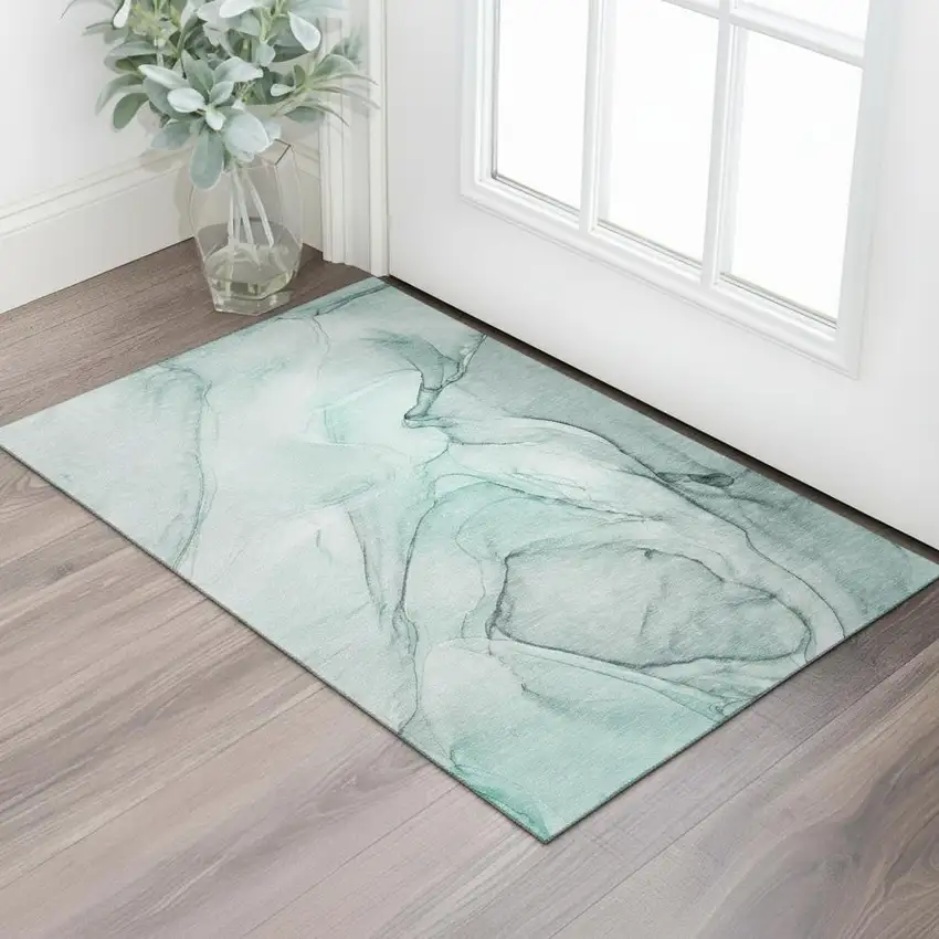 Teal And Ivory Abstract Washable Area Rug With UV Protection Photo 1