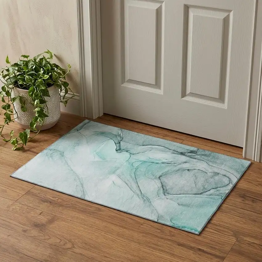 Teal And Ivory Abstract Washable Area Rug With UV Protection Photo 1