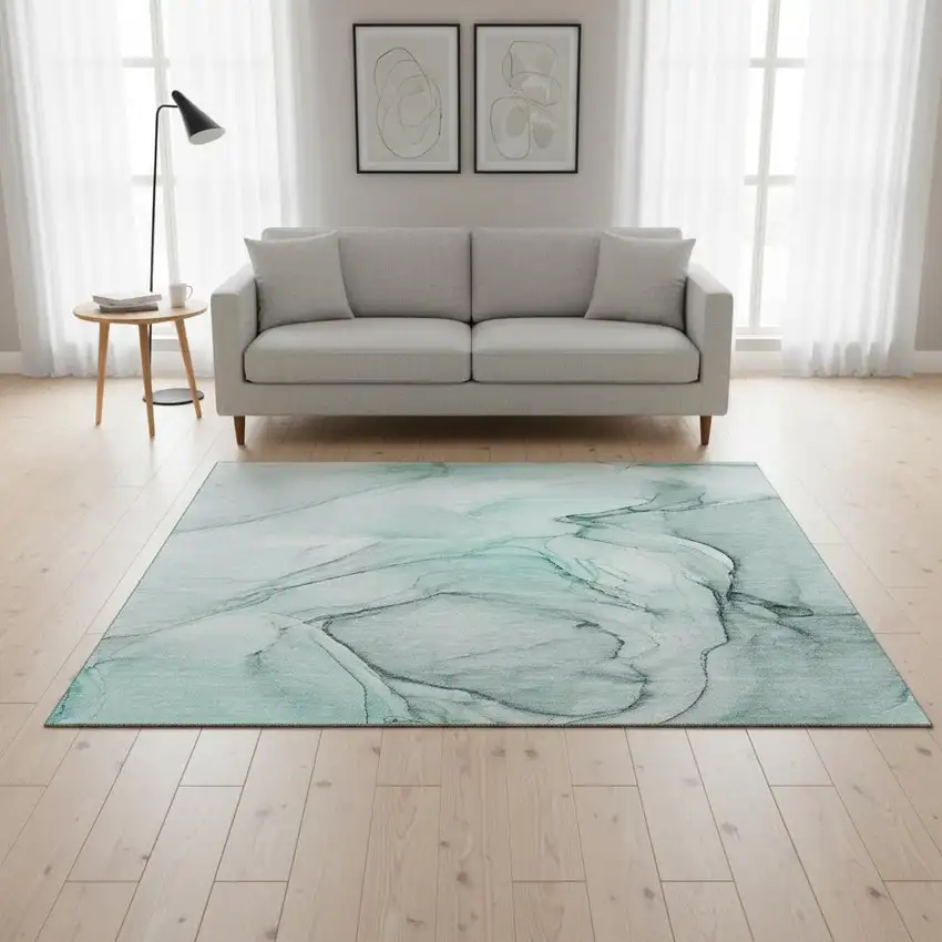 Teal And Ivory Abstract Washable Area Rug With UV Protection Photo 1