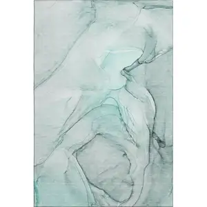 Photo of Teal And Ivory Abstract Washable Area Rug With UV Protection