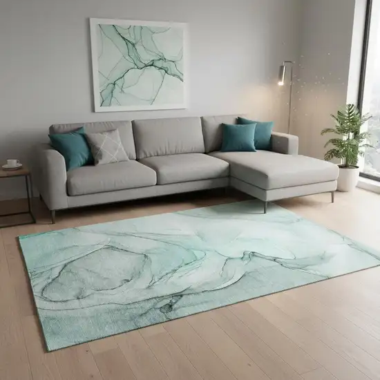 Teal And Ivory Abstract Washable Area Rug With UV Protection Photo 1