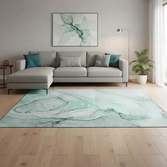 Teal And Ivory Abstract Washable Area Rug With UV Protection Photo 1
