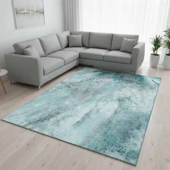 Teal And Ivory Abstract Washable Area Rug With UV Protection Photo 1