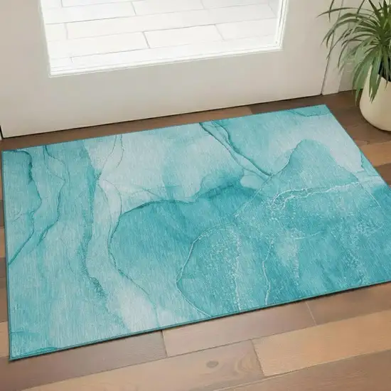 Teal And Ivory Abstract Washable Area Rug With UV Protection Photo 1