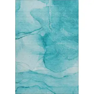 Photo of Teal And Ivory Abstract Washable Area Rug With UV Protection
