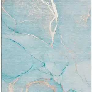 Photo of Teal And Ivory Abstract Washable Area Rug With UV Protection