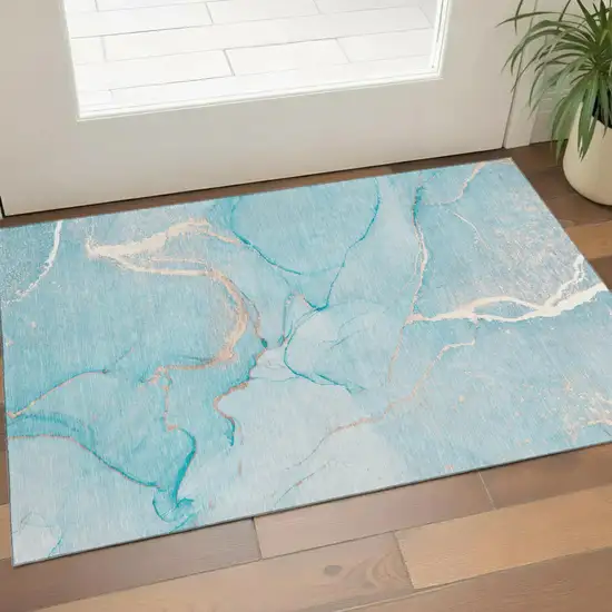 Teal And Ivory Abstract Washable Area Rug With UV Protection Photo 1