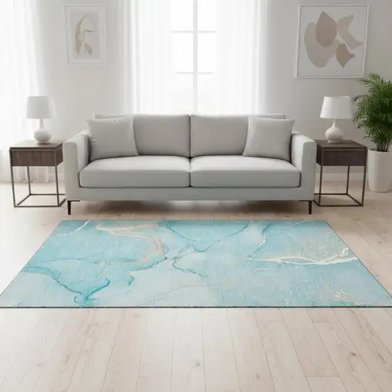 Teal And Ivory Abstract Washable Area Rug With UV Protection Photo 1