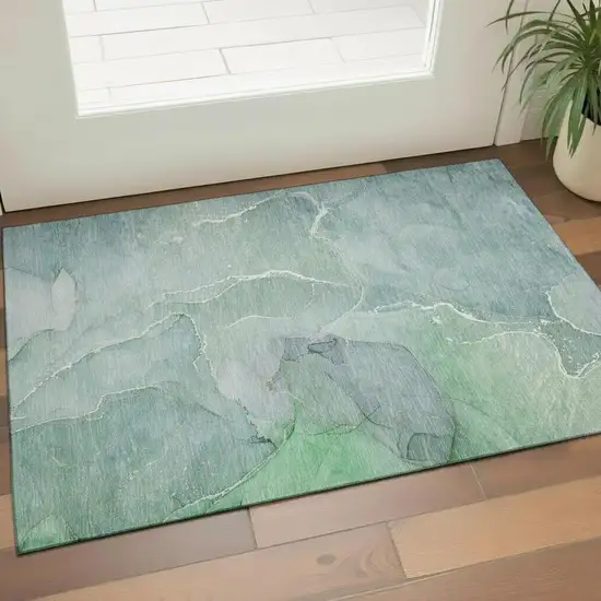 Teal And Ivory Abstract Washable Area Rug With UV Protection Photo 2