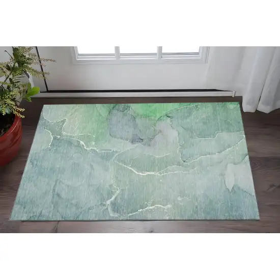 Teal And Ivory Abstract Washable Area Rug With UV Protection Photo 2