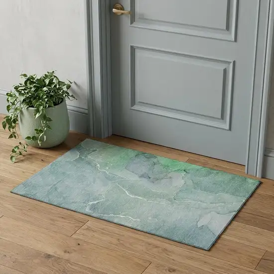 Teal And Ivory Abstract Washable Area Rug With UV Protection Photo 1