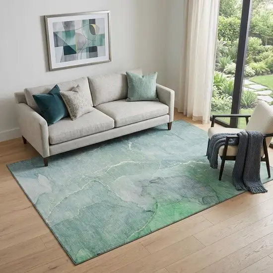 Teal And Ivory Abstract Washable Area Rug With UV Protection Photo 1