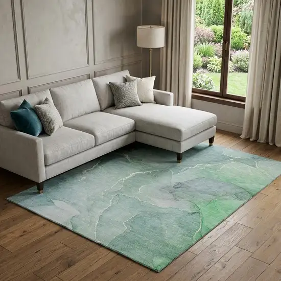 Teal And Ivory Abstract Washable Area Rug With UV Protection Photo 1