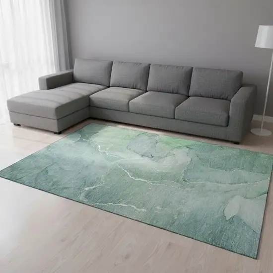 Teal And Ivory Abstract Washable Area Rug With UV Protection Photo 1