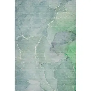 Photo of Teal And Ivory Abstract Washable Area Rug With UV Protection
