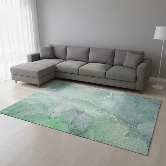 Teal And Ivory Abstract Washable Area Rug With UV Protection Photo 1