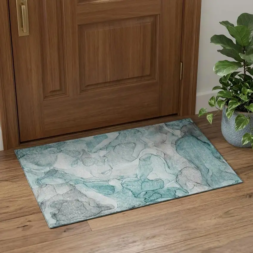 Teal And Ivory Abstract Washable Area Rug With UV Protection Photo 1