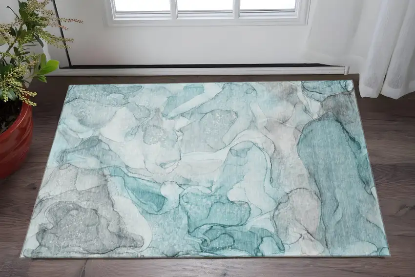 Teal And Ivory Abstract Washable Area Rug With UV Protection Photo 2