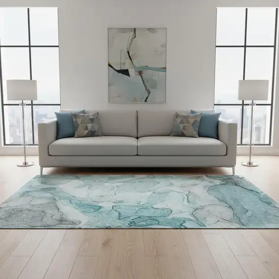 Teal And Ivory Abstract Washable Area Rug With UV Protection Photo 1