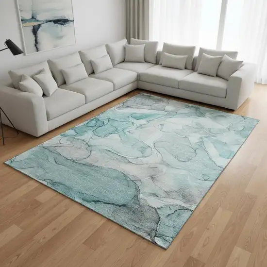 Teal And Ivory Abstract Washable Area Rug With UV Protection Photo 1