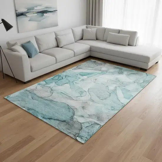 Teal And Ivory Abstract Washable Area Rug With UV Protection Photo 1