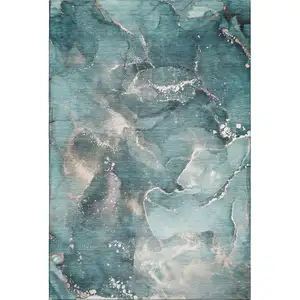 Photo of Teal And Ivory Abstract Washable Area Rug With UV Protection
